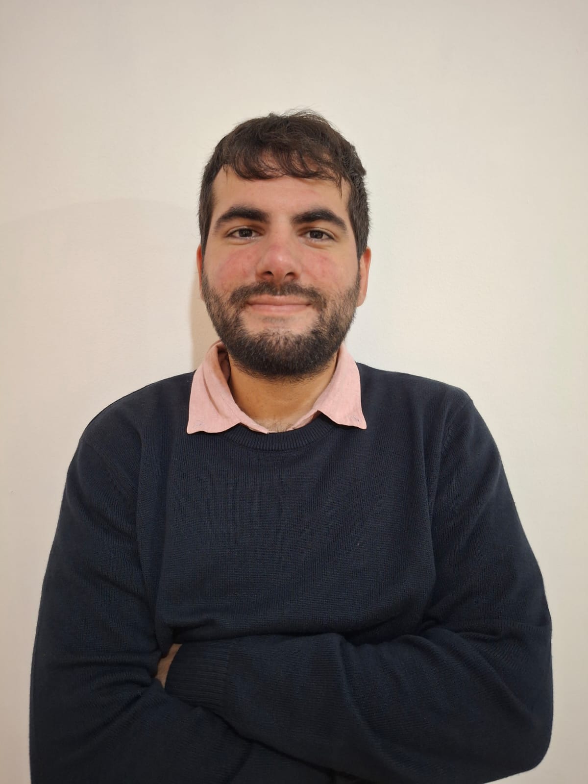 Manuel Feito Saudan in a professional portrait, looking toward the camera with a calm confident expression against a simple neutral background